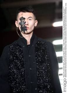 A model takes to the catwalk during the presentation of Walter Van Beirendonck s collection as part of the 2016-1017 Fall-Winter fashion collection in Paris, on January 20, 2016.  PAR20160120102 MAYAxVIDON-WHITE