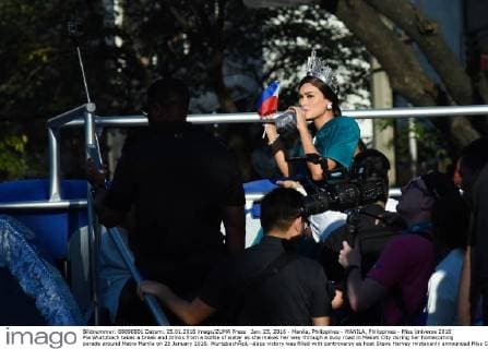 Jan. 25, 2016 - Manila, Philippines - MANILA, Philippines - Miss Universe 2016 Pia Wurtzbach takes a break and drinks from a bottle of water as she makes her way through a busy road in Makati City during her homecoming parade around Metro Manila on 25 January 2016. WurtzbachÃ¢â‚¬â„¢s victory was filled with controversy as host Steve Harvey mistakenly announced Miss Colombia Ariadna Gutierrez as the winner. Manila Philippines  - ZUMAn230