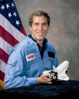 Official NASA portrait, taken on January 8, 1981, of astronaut Michael J. Smith, Pilot for STS-51-L. On January 28, 1986, at 11:39 a.m. EST, the Space Shuttle Challenger and her seven-member crew were lost when a ruptured O-ring in the right Solid Rocket Booster caused an explosion 73 seconds after launch.  WAX2016012504 NASA......