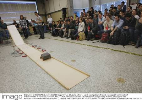 Students gather to watch a competition of robotic vehicles at the University of British Columbia in Vancouver, Cananda, Jan. 27, 2016. The robotic vehicles are made by UBC s engineering students, all equipped with automatic braking and speed control system. ) CANADA-VANCOUNVER-ROBOTIC VEHICLE-COMPETITION LiangxSen 