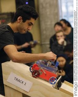 Students adjust their robotic vehicle during a competition at the University of British Columbia in Vancouver, Cananda, Jan. 27, 2016. The robotic vehicles are made by UBC s engineering students, all equipped with automatic braking and speed control system. ) CANADA-VANCOUNVER-ROBOTIC VEHICLE-COMPETITION LiangxSen 