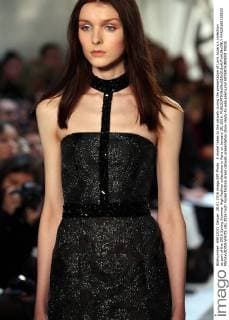 A model takes to the catwalk during the presentation of Loris Azzaro s collection as part of the 2016 Spring Summer High Fashion collections in Paris on January 28, 2016.  PAR20160128103 MAYAxVIDON-WHITE