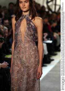 A model takes to the catwalk during the presentation of Loris Azzaro s collection as part of the 2016 Spring Summer High Fashion collections in Paris on January 28, 2016.  PAR20160128104 MAYAxVIDON-WHITE