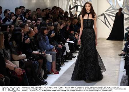 A model takes to the catwalk during the presentation of Loris Azzaro s collection as part of the 2016 Spring Summer High Fashion collections in Paris on January 28, 2016.  PAR20160128111 MAYAxVIDON-WHITE