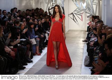 A model takes to the catwalk during the presentation of Loris Azzaro s collection as part of the 2016 Spring Summer High Fashion collections in Paris on January 28, 2016.  PAR20160128114 MAYAxVIDON-WHITE