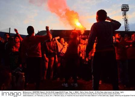 Feb. 1, 2016 - Cairo, Cairo, Egypt - Al Ahly fans, also known as Ultras , light flares and shout slogans at al-Ahly club s training stadium marking the fourt anniversary of killing al-Ahly fans in what known as the Port Said massacre , on February 1, 2016. On 1 February 2012, a massive riot occurred at Port Said Stadium in Port Said city, Egypt, following an Egyptian Premier League football match between El Masry and El Ahly clubs. At least 74 people were killed and more than 500 were injured after thousands of El Masry spectators stormed the stadium stands and the pitch Cairo Egypt - ZUMAap3_