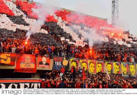 Feb. 1, 2016 - Cairo, Cairo, Egypt - Al Ahly fans, also known as Ultras , light flares and shout slogans at al-Ahly club s training stadium marking the fourt anniversary of killing al-Ahly fans in what known as the Port Said massacre , on February 1, 2016. On 1 February 2012, a massive riot occurred at Port Said Stadium in Port Said city, Egypt, following an Egyptian Premier League football match between El Masry and El Ahly clubs. At least 74 people were killed and more than 500 were injured after thousands of El Masry spectators stormed the stadium stands and the pitch Cairo Egypt - ZUMAap3_