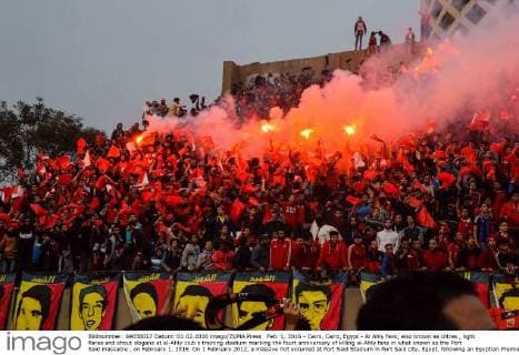 Feb. 1, 2016 - Cairo, Cairo, Egypt - Al Ahly fans, also known as Ultras , light flares and shout slogans at al-Ahly club s training stadium marking the fourt anniversary of killing al-Ahly fans in what known as the Port Said massacre , on February 1, 2016. On 1 February 2012, a massive riot occurred at Port Said Stadium in Port Said city, Egypt, following an Egyptian Premier League football match between El Masry and El Ahly clubs. At least 74 people were killed and more than 500 were injured after thousands of El Masry spectators stormed the stadium stands and the pitch Cairo Egypt - ZUMAap3_