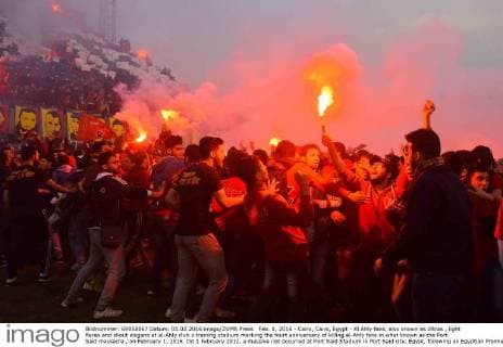 Feb. 1, 2016 - Cairo, Cairo, Egypt - Al Ahly fans, also known as Ultras , light flares and shout slogans at al-Ahly club s training stadium marking the fourt anniversary of killing al-Ahly fans in what known as the Port Said massacre , on February 1, 2016. On 1 February 2012, a massive riot occurred at Port Said Stadium in Port Said city, Egypt, following an Egyptian Premier League football match between El Masry and El Ahly clubs. At least 74 people were killed and more than 500 were injured after thousands of El Masry spectators stormed the stadium stands and the pitch Cairo Egypt - ZUMAap3_