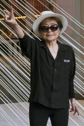 Yoko Ono opens new exhibition on violence against women Artist Yoko Ono flashes a peace sign at a museum in Mexico City on Feb. 2, 2016 during an event for her new exhibition themed on women struggling against violence. The works by Ono feature photographs of the eyes of more than 1,000 women along with descriptions of the damage they suffered. The widow of John Lennon expressed hope that her works will inspire people to take a stand against violence. 