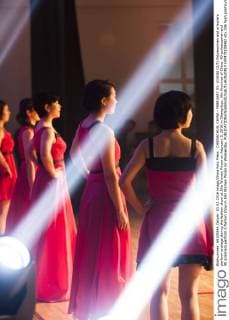 CHANGCHUN, CHINA - FEBRUARY 03: (CHINA OUT) Policewomen and prisoners perform onstage during the fashion show at Jilin Women Prison on February 3, 2016 in Changchun, Jilin Province of China. 40 policewomen and 40 prisoners perform a fashion show in Jilin Women Prison on Wednesday.  CFP479100482