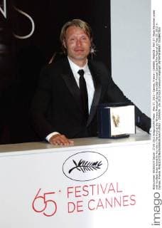 May 27, 2012 - Cannes, France - CANNES, FRANCE - MAY 27: Mads Mikkelsen poses with his Best Actor Award for his role in The Hunt at the Winners Photocall during the 65th Annual Cannes Film Festival on May 27, 2012 in Cannes, France. - ZUMAi09_