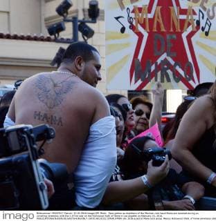 Fans gather as members of the Mexican rock band Mana are honored during an unveiling ceremony with the 2,573rd star on the Hollywood Walk of Fame in Los Angeles on February 10, 2016.  LAP2016021012 JIMxRUYMEN