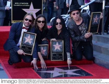 Alex Gonzalez, Sergio Vallin, Juan Calleros and Fher Olvera (L-R), members of the Mexican rock band Mana hold replica plaques during an unveiling ceremony honoring the group with the 2,573rd star on the Hollywood Walk of Fame in Los Angeles on February 10, 2016.  LAP2016021016 JIMxRUYMEN