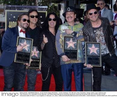 Carlos Santana, 4th left joins Alex Gonzalez, Sergio Vallin, Juan Calleros and Fher Olvera (L-R), members of the Mexican rock band Mana during an unveiling ceremony honoring the group with the 2,573rd star on the Hollywood Walk of Fame in Los Angeles on February 10, 2016.  LAP2016021017 JIMxRUYMEN