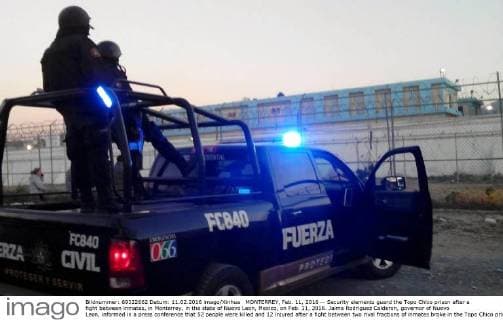 MONTERREY, Feb. 11, 2016 -- Security elements guard the Topo Chico prison after a fight between inmates, in Monterrey, in the state of Nuevo Leon, Mexico, on Feb. 11, 2016. Jaime Rodriguez Calderon, governor of Nuevo Leon, informed in a press conference that 52 people were killed and 12 injured after a fight between two rival fractions of inmates broke in the Topo Chico prison. Str) (ce) MEXICO-MONTERREY-SECURITY-PRISON e STR 