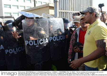 (160211) -- MONTERREY, Feb. 11, 2016 -- Family members of inmates argue with security elements as they wait for information outside the Topo Chico prison, in Monterrey, in the state of Nuevo Leon, Mexico, on Feb. 11, 2016. Jaime Rodriguez Calderon, governor of Nuevo Leon, informed a press conference that 52 people were killed and 12 injured after a fight broke out between two rival fractions of inmates inside the Topo Chico prison. ABC) (ce) MEXICO-MONTERREY-SECURITY-PRISON e ABC 