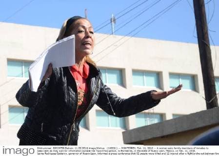 (160211) -- MONTERREY, Feb. 11, 2016 -- A woman asks family members of inmates to keep calm as they wait for information outside the Topo Chico prison, in Monterrey, in the state of Nuevo Leon, Mexico, on Feb. 11, 2016. Jaime Rodriguez Calderon, governor of Nuevo Leon, informed a press conference that 52 people were killed and 12 injured after a fight broke out between two rival fractions of inmates inside the Topo Chico prison. ABC) (ce) MEXICO-MONTERREY-SECURITY-PRISON e ABC 