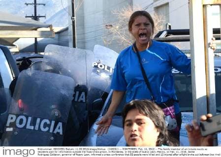 (160211) -- MONTERREY, Feb. 11, 2016 -- The family member of an inmate reacts as residents wait for information outside the Topo Chico prison, in Monterrey, in the state of Nuevo Leon, Mexico, on Feb. 11, 2016. Jaime Rodriguez Calderon, governor of Nuevo Leon, informed a press conference that 52 people were killed and 12 injured after a fight broke out between two rival fractions of inmates inside the Topo Chico prison. ABC) (ce) MEXICO-MONTERREY-SECURITY-PRISON e ABC 