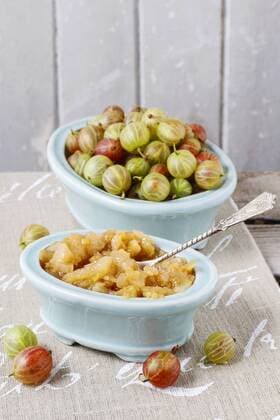 Bowls of gooseberries and jam. Healthy fruits  bew1B02F4E