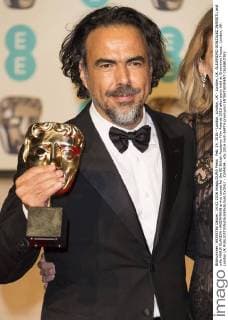 Feb. 14, 2016 - London, London, UK - London, UK. ALEJANDRO GONZALEZ INARRITU and wife MARIA ELANDIA HAGERMANN arrive carpet for the EE British Academy Film Awards 2016 after party held at Grosvenor House . London, UK. London UK  - ZUMAl94_