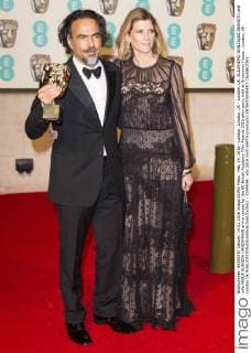 Feb. 14, 2016 - London, London, UK - London, UK. ALEJANDRO GONZALEZ INARRITU and wife MARIA ELANDIA HAGERMANN arrive carpet for the EE British Academy Film Awards 2016 after party held at Grosvenor House . London, UK. London UK  - ZUMAl94_