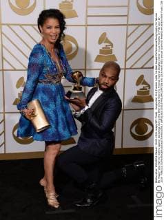 Songwriter Kirk Franklin holds his Best Gospel Performance Song trophy for Wanna Be Happy? and Tammy Collins appear backstage during the 58th annual Grammy Awards held at Staples Center in Los Angeles on February 15, 2016.  LAP20160215813 PHILxMCCARTEN