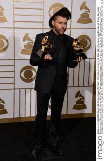The Weeknd, winner of the Best R&B Performance award for Earned It, and Best Urban Contemporary Album award for Beauty Behind The Madness, appears backstage with the award for XXX during the 58th annual Grammy Awards held at Staples Center in Los Angeles on February 15, 2016.  LAP201602151045 PHILxMCCARTEN