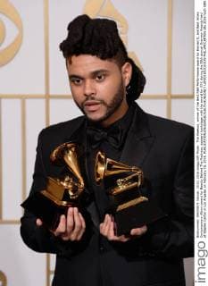 The Weeknd, winner of the Best R&B Performance award for Earned It, and Best Urban Contemporary Album award for Beauty Behind The Madness, appears backstage with the award for XXX during the 58th annual Grammy Awards held at Staples Center in Los Angeles on February 15, 2016.  LAP201602151039 PHILxMCCARTEN