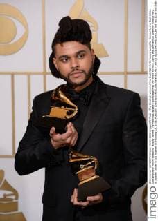 The Weeknd, winner of the Best R&B Performance award for Earned It, and Best Urban Contemporary Album award for Beauty Behind The Madness, appears backstage with the award for XXX during the 58th annual Grammy Awards held at Staples Center in Los Angeles on February 15, 2016.  LAP201602151040 PHILxMCCARTEN