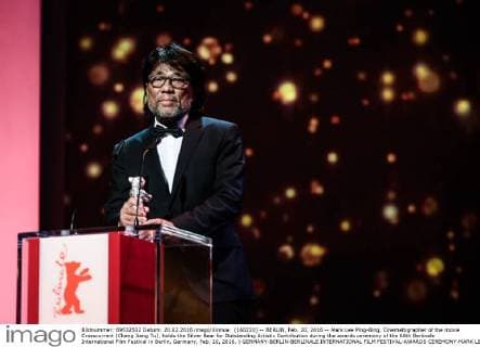 (160220) -- BERLIN, Feb. 20, 2016 -- Mark Lee Ping-Bing, Cinematographer of the movie Crosscurrent (Chang Jiang Tu), holds the Silver Bear for Outstanding Artistic Contribution during the awards ceremony of the 66th Berlinale International Film Festival in Berlin, Germany, Feb. 20, 2016. ) GERMANY-BERLIN-BERLINALE INTERNATIONAL FILM FESTIVAL-AWARDS CEREMONY-MARK LEE ZhangxFan 