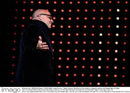 Italian director Gianfranco Rosi steps on stage to receive the Golden Bear for Best Film for the film Fire at Sea during the awards ceremony of the 66th Berlinale International Film Festival in Berlin, Germany, Feb. 20, 2016. The Italian documentary film Fire at Sea won the Golden Bear, the top jury prize awarded to the best film, in the 66th Berlin International Film Festival on Saturday. ) GERMANY-BERLIN-BERLINALE INTERNATIONAL FILM FESTIVAL-AWARDS CEREMONY-GOLD BEAR-GIANFRANCO ROSI ZhangxFan 
