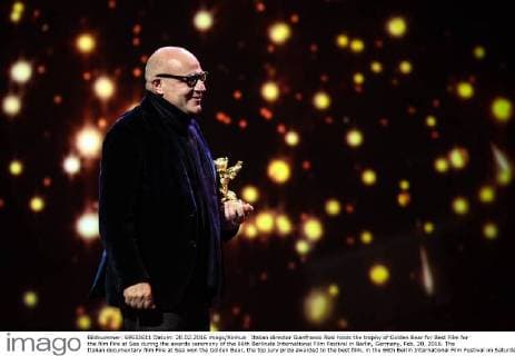 Italian director Gianfranco Rosi holds the trophy of Golden Bear for Best Film for the film Fire at Sea during the awards ceremony of the 66th Berlinale International Film Festival in Berlin, Germany, Feb. 20, 2016. The Italian documentary film Fire at Sea won the Golden Bear, the top jury prize awarded to the best film, in the 66th Berlin International Film Festival on Saturday. ) GERMANY-BERLIN-BERLINALE INTERNATIONAL FILM FESTIVAL-AWARDS CEREMONY-GOLD BEAR-GIANFRANCO ROSI ZhangxFan 