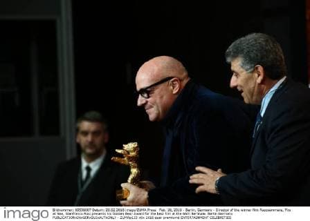 Feb. 20, 2016 - Berlin, Germany - Director of the winner film Fuocoammare, Fire at Sea, Gianfranco Rosi presents his Golden Bear Award for the best film at the 66th Berlinale. Berlin Germany - ZUMAp133