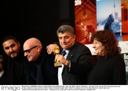 Feb. 20, 2016 - Berlin, Germany - Director of the winner film Fuocoammare, Fire at Sea, Gianfranco Rosi and actor Pietro Bartolo present Golden Bear Award for the best film at the 66th Berlinale. Berlin Germany - ZUMAp133