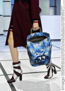 Feb. 21, 2016 - London, London, UK - Model on the catwalk holding a handbag at the ANYA HINDMARCH Autumn Winter 2016 show. Models, buyers, celebrities and the stylish descend upon London Fashion Week for the Autumn Winters 2016 clothes collection shows. London, UK. London UK  - ZUMAl94_