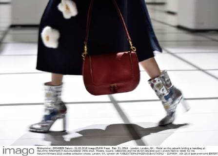 Feb. 21, 2016 - London, London, UK - Model on the catwalk holding a handbag at the ANYA HINDMARCH Autumn Winter 2016 show. Models, buyers, celebrities and the stylish descend upon London Fashion Week for the Autumn Winters 2016 clothes collection shows. London, UK. London UK  - ZUMAl94_