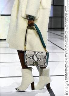 Feb. 21, 2016 - London, London, UK - Model on the catwalk holding a handbag at the ANYA HINDMARCH Autumn Winter 2016 show. Models, buyers, celebrities and the stylish descend upon London Fashion Week for the Autumn Winters 2016 clothes collection shows. London, UK. London UK  - ZUMAl94_