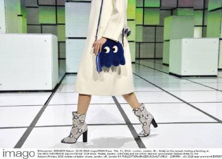Feb. 21, 2016 - London, London, UK - Model on the catwalk holding a handbag at the ANYA HINDMARCH Autumn Winter 2016 show. Models, buyers, celebrities and the stylish descend upon London Fashion Week for the Autumn Winters 2016 clothes collection shows. London, UK. London UK  - ZUMAl94_