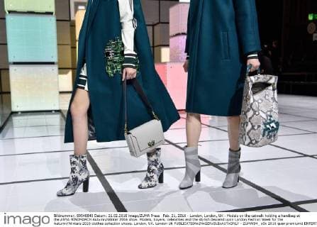 Feb. 21, 2016 - London, London, UK - Models on the catwalk holding a handbag at the ANYA HINDMARCH Autumn Winter 2016 show. Models, buyers, celebrities and the stylish descend upon London Fashion Week for the Autumn Winters 2016 clothes collection shows. London, UK. London UK  - ZUMAl94_