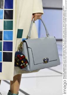 Feb. 21, 2016 - London, London, UK - Model on the catwalk holding a handbag at the ANYA HINDMARCH Autumn Winter 2016 show. Models, buyers, celebrities and the stylish descend upon London Fashion Week for the Autumn Winters 2016 clothes collection shows. London, UK. London UK  - ZUMAl94_