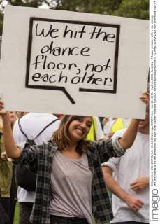 Feb. 21, 2016 - Sydney, NSW, Australia - A happy protester with a sign stating she only wishes to hit the dance floor not each other Sydney Australia - ZUMAp133