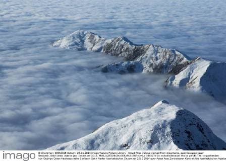 Cloud filled valleys viewed from mountains, east Caucasus near Saribash, Gakh area, Azerbaijan, December 2012.  1463278 Dr.xxAxelxGebauer