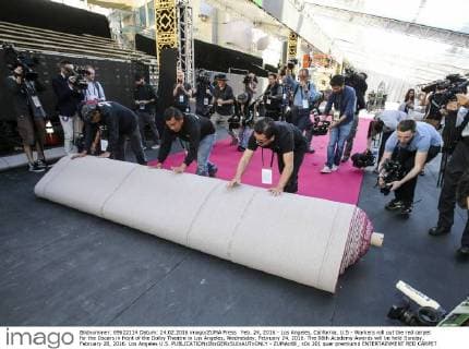 Feb. 24, 2016 - Los Angeles, California, U.S - Workers roll out the red carpet for the Oscars in front of the Dolby Theatre in Los Angeles, Wednesday, February 24, 2016. The 88th Academy Awards will be held Sunday, February 28, 2016. Los Angeles U.S. - ZUMAc68_
