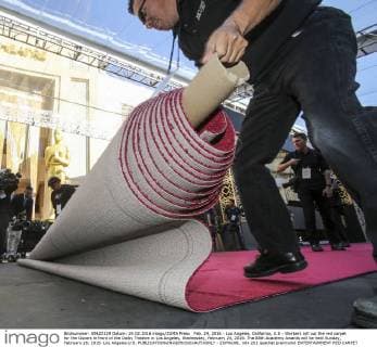 Feb. 24, 2016 - Los Angeles, California, U.S - Workers roll out the red carpet for the Oscars in front of the Dolby Theatre in Los Angeles, Wednesday, February 24, 2016. The 88th Academy Awards will be held Sunday, February 28, 2016. Los Angeles U.S. - ZUMAc68_