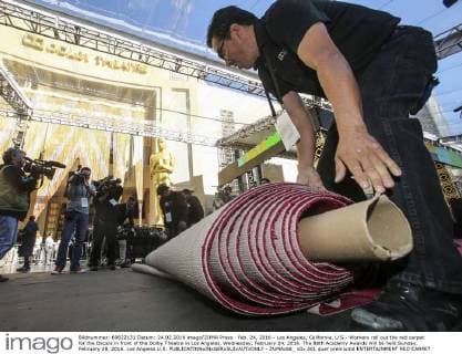 Feb. 24, 2016 - Los Angeles, California, U.S - Workers roll out the red carpet for the Oscars in front of the Dolby Theatre in Los Angeles, Wednesday, February 24, 2016. The 88th Academy Awards will be held Sunday, February 28, 2016. Los Angeles U.S. - ZUMAc68_