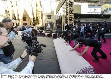 Feb. 24, 2016 - Los Angeles, California, U.S - Workers roll out the red carpet for the Oscars in front of the Dolby Theatre in Los Angeles, Wednesday, February 24, 2016. The 88th Academy Awards will be held Sunday, February 28, 2016. Los Angeles U.S. - ZUMAc68_