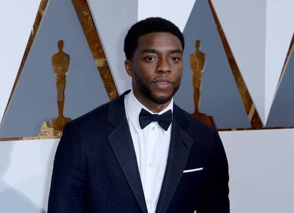 Actor Chadwick Boseman arrives on the red carpet for the 88th Academy Awards, at the Hollywood and Highland Center in the Hollywood section of Los Angeles on February 28, 2016.  LAP20160228701 JIMxRUYMEN