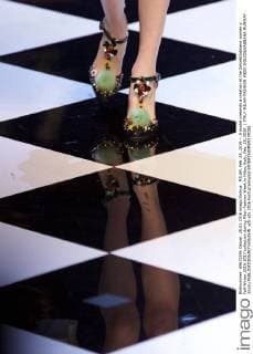 MILAN, Feb. 28, 2016 -- A model presents a creation at the Dolce&Gabbana women s Fall-Winter 2016-2017 collection during Milan Fashion Week in Milan, Italy, Feb. 28, 2016. ) ITALY-MILAN-FASHION WEEK-DOLCE&GABBANA-RUNWAY JinxYu 