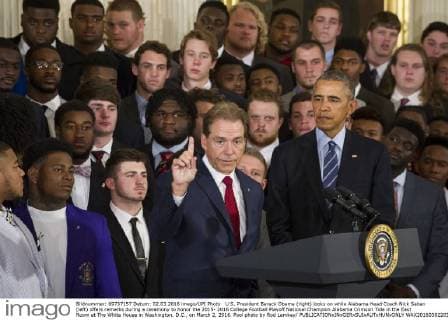 U.S. President Barack Obama (right) looks on while Alabama Head Coach Nick Saban (left) offers remarks during a ceremony to honor the 2015- 2016 College Football Playoff National Champion Alabama Crimson Tide in the East Room at The White House in Washington, D.C., on March 2, 2016. Pool photo by Rod Lamkey  WAX20160302203 RODxLAMKEYxJR.